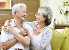 Loving,Asian,Couple,Looking,At,Each,Other,Smiling,With,Appreciation